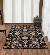 Luxury black wool rug featuring gold and beige floral motifs